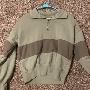 a cropped quarter zip